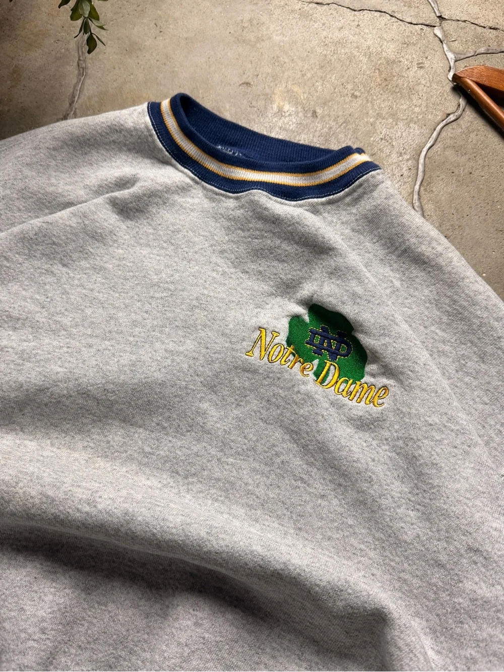 The Game Men’s Gray Crewneck Sweatshirt with Navy Trim and Green Logo